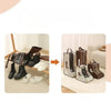 A set of brown and white waterproof foldable boots stored in black and brown fabric storage bags.
