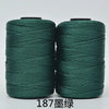 Spool of dark green hand knitting and crochet cord for crafting