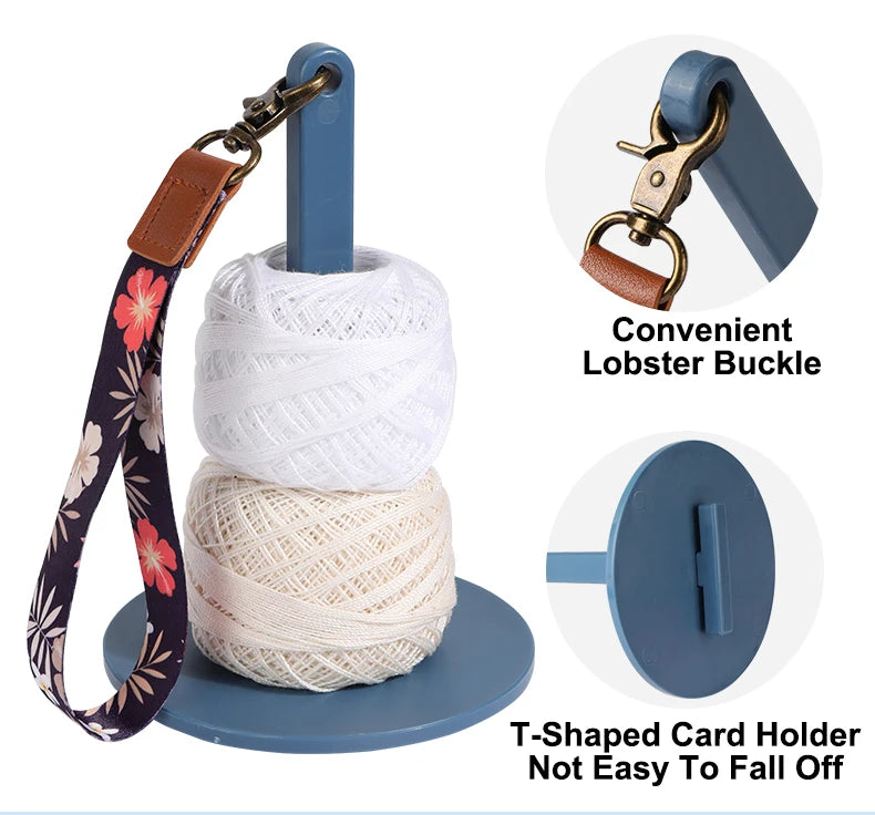 A white yarn holder with a leather strap and a lobster buckle, designed as a T-shaped card holder.
