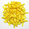 A pile of small yellow satin ribbon bows for crafts and decor.
