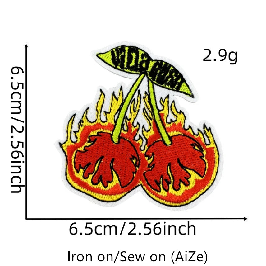 A yellow embroidered fruit patch featuring a flame design, measuring 6.5cm by 2.56inch.