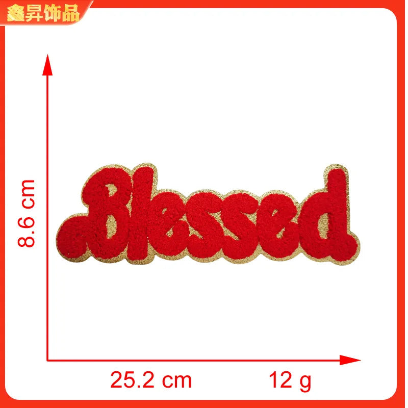 Red felt embroidery patch spelling the word Blessed