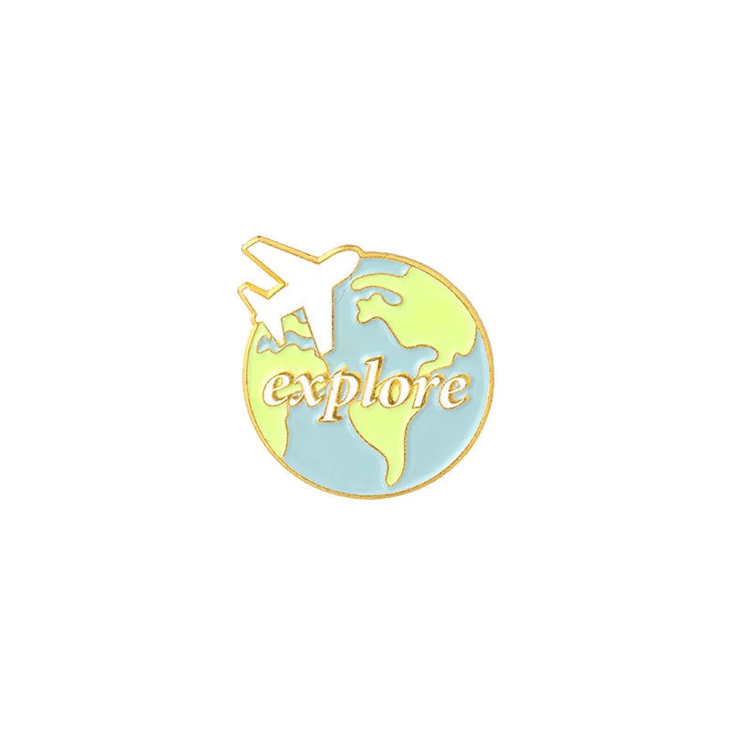 A lapel pin featuring a silhouette of an airplane flying over a stylized map of the Earth.