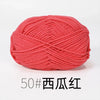 A ball of bright coral pink knitting yarn labeled 50# in dark text.