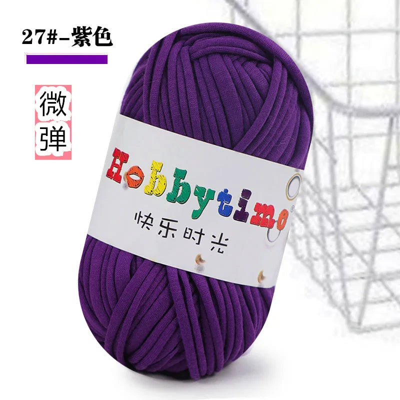 Purple thick craft yarn skein with a white label featuring the Hobbytime logo
