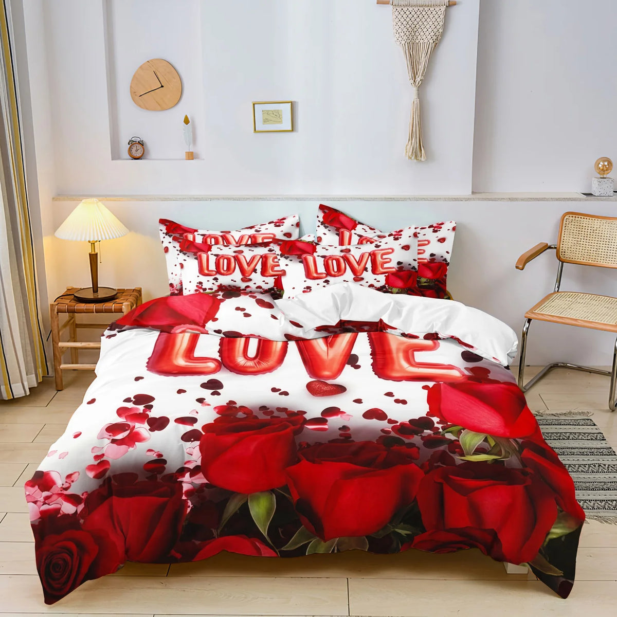 A bedding set featuring a floral pattern with red roses and leaves on white fabric.