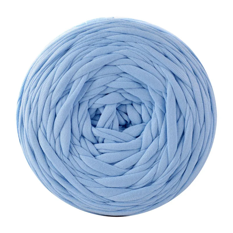 A ball of light blue soft T-shirt yarn for crochet