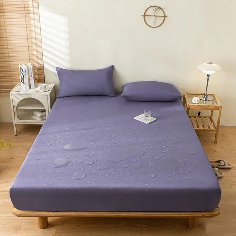 A purple waterproof mattress and bed protector sheet is laid out on a wooden bed frame in a bright room.