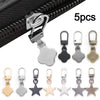 A set of five metal zipper pull replacements including various shapes like hearts, leaves, and stars.