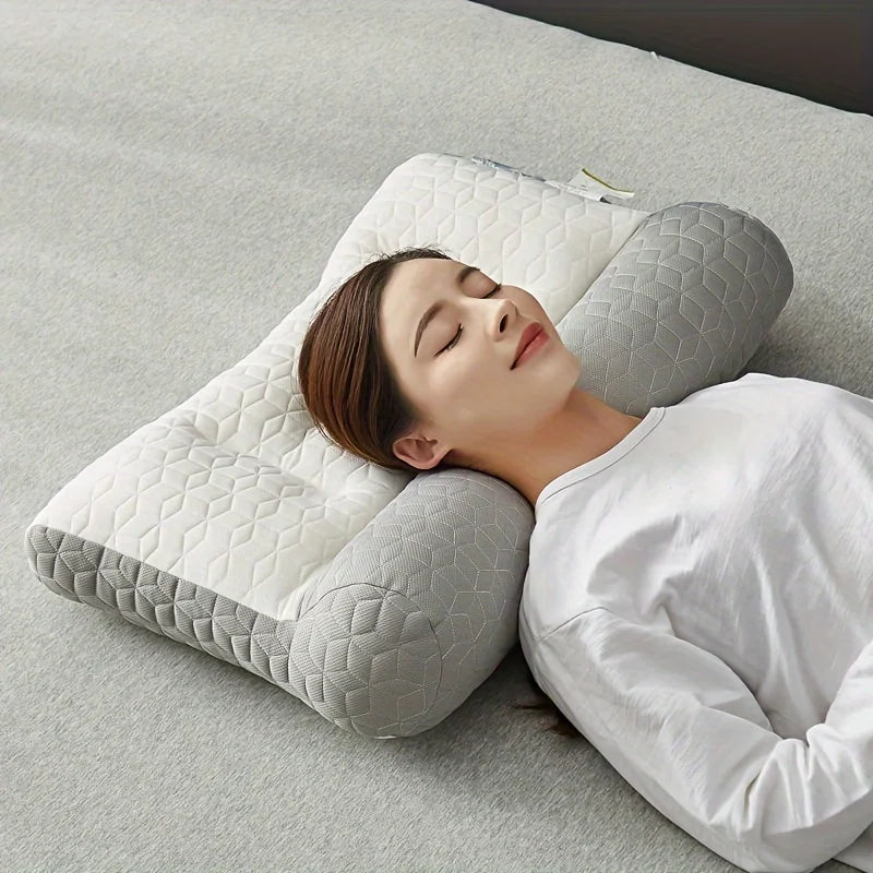 A woman is resting her head on a white 3D ergonomic contour pillow for neck and spine support on a light gray surface.
