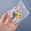 A hand holds an open clear box of colorful nickel-plated dressmaking pins with various colored heads.