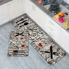A rectangular kitchen mat featuring a heart design with knife and fork graphics on a gray distressed background.