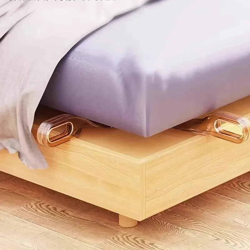 A mattress lifter wedge is shown under a bed, used for easy bedding changes.