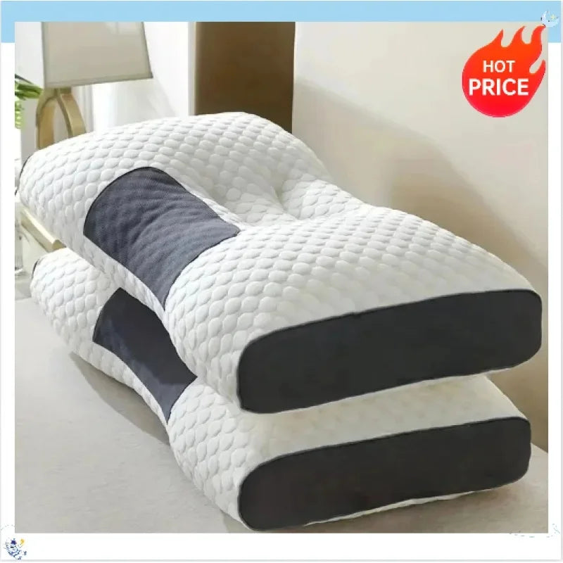 A stack of white and dark gray ergonomic contour neck pillows on a light surface.