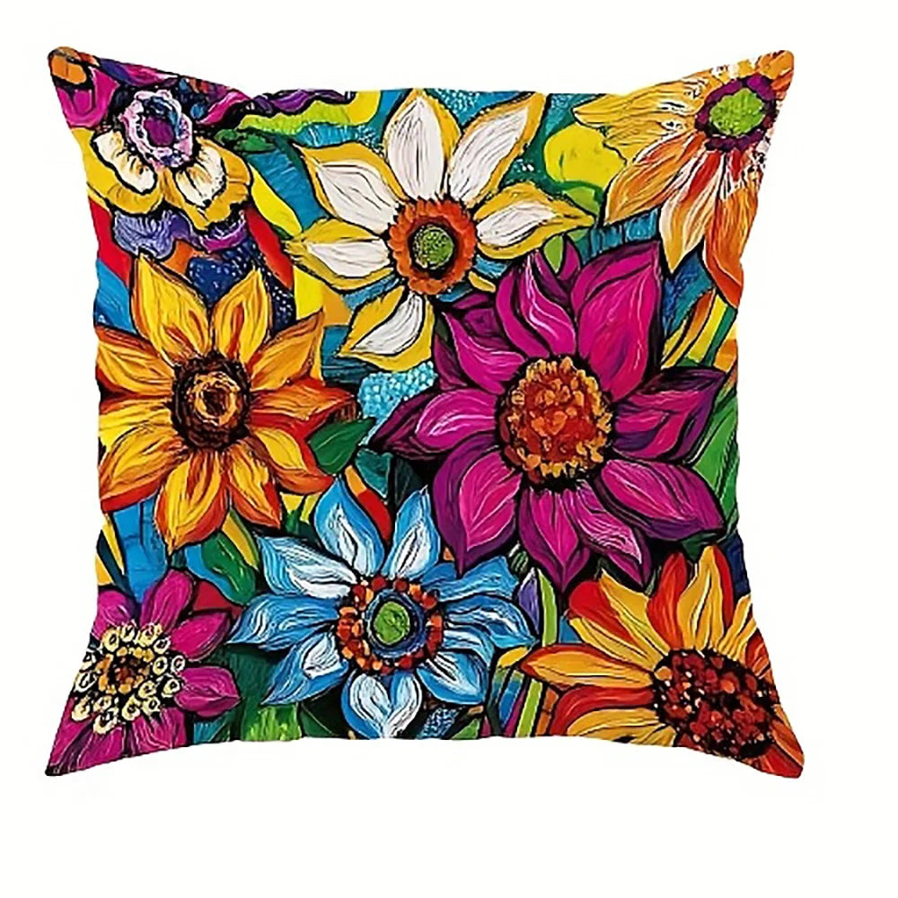 A decorative pillow cover featuring a vibrant, colorful floral pattern with yellow, pink, purple, and blue flowers.