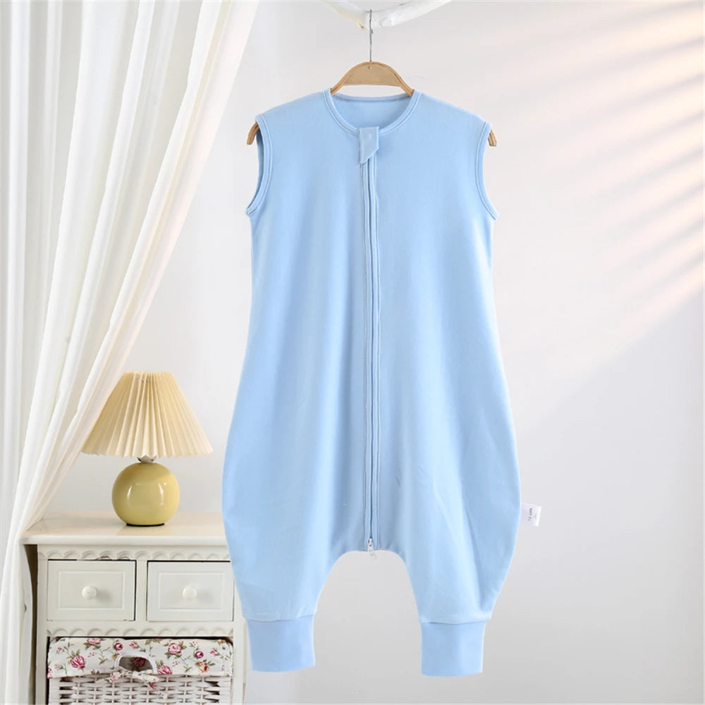 Light blue cotton striped sleeping bag for children hanging on a wooden hanger