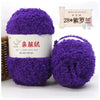 Purple soft coral velvet yarn skeins with a wooden sign indicating 28 balls for crafting