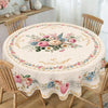 Vintage pink rose sunflower floral tablecloth displayed on a wooden dining table.