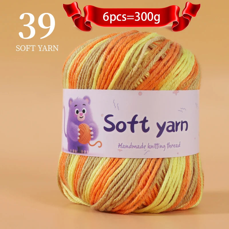 A ball of 39 soft yarn strands in shades of orange and yellow for hand knitting.