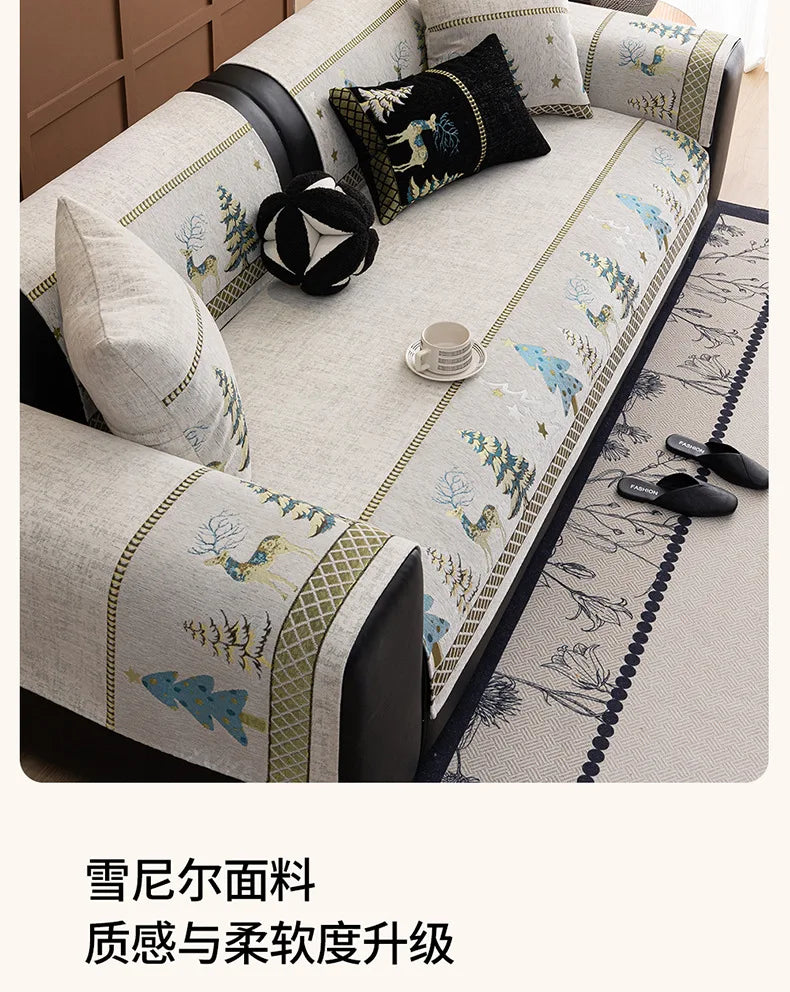 A beige sofa mat cover featuring a delicate Christmas deer pattern with green and blue accents.