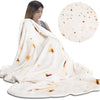 A white blanket throw with brown stains is draped over a person, next to a circular piece of pizza dough.