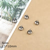 A set of small black and white ladybug resin charms displayed on a brown surface.