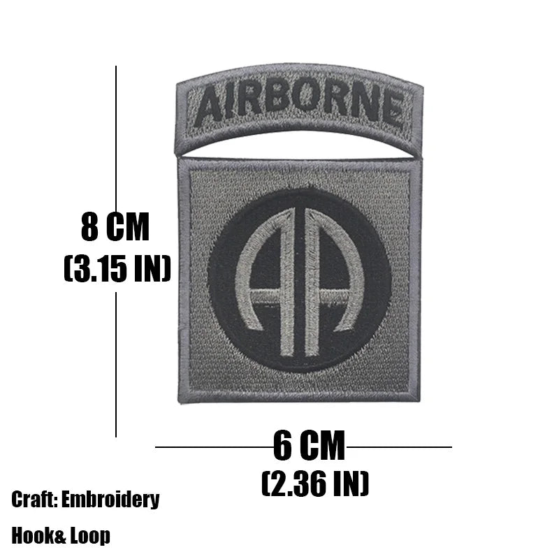 Gray embroidered tactical patch with an Airborne banner and a large AA symbol.