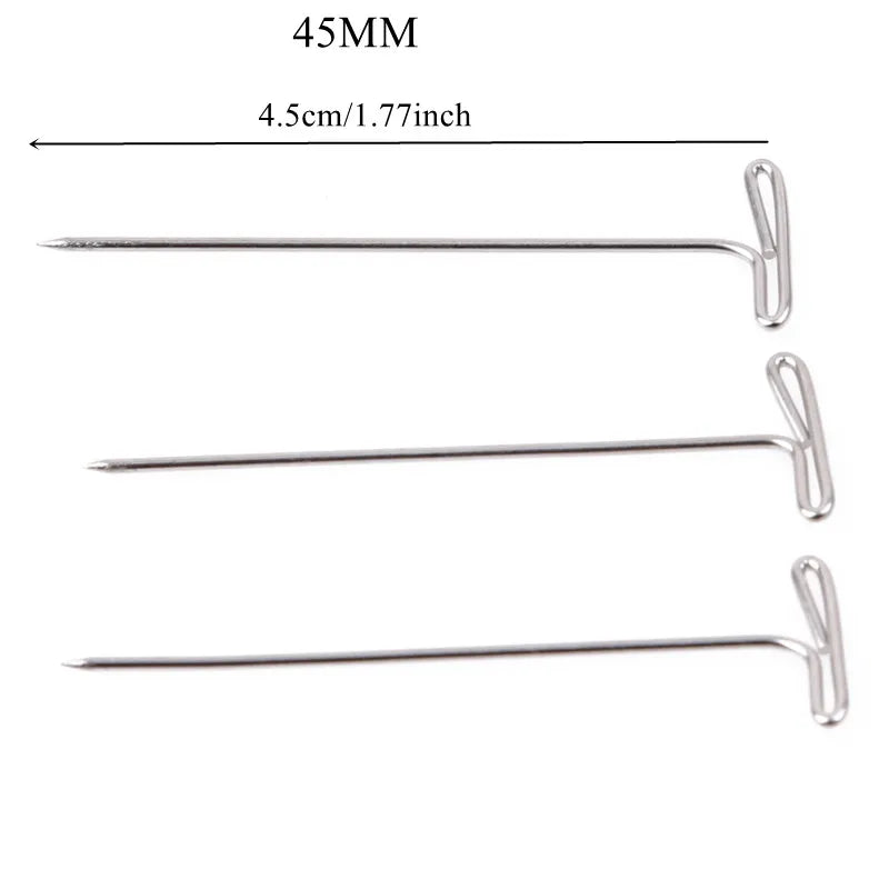 Three stainless steel T-pins measuring 45mm long for wig making or knitting.