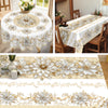 Elegant floral tablecloth featuring white and gold embossed patterns for dining.
