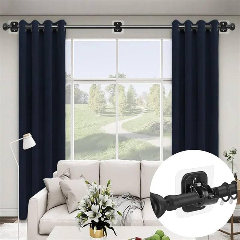 Dark blue curtain rods and brackets installed on a window with sheer white curtains.