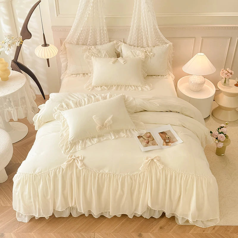 A luxurious white princess chiffon duvet cover set displayed on a bed with sheer white drapery and decorative pillows.