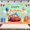 A colorful birthday party backdrop featuring a cartoon red race car, balloons, and festive decorations.