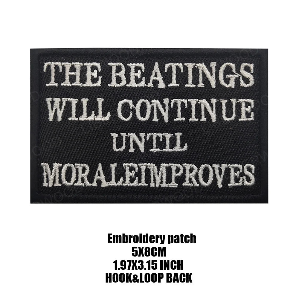 Black embroidered patch with white text that reads The Beatings Will Continue Until Morale Improves