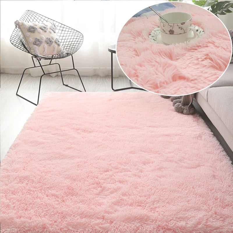 A fluffy pink area rug with a soft texture is displayed in a bright room setting.