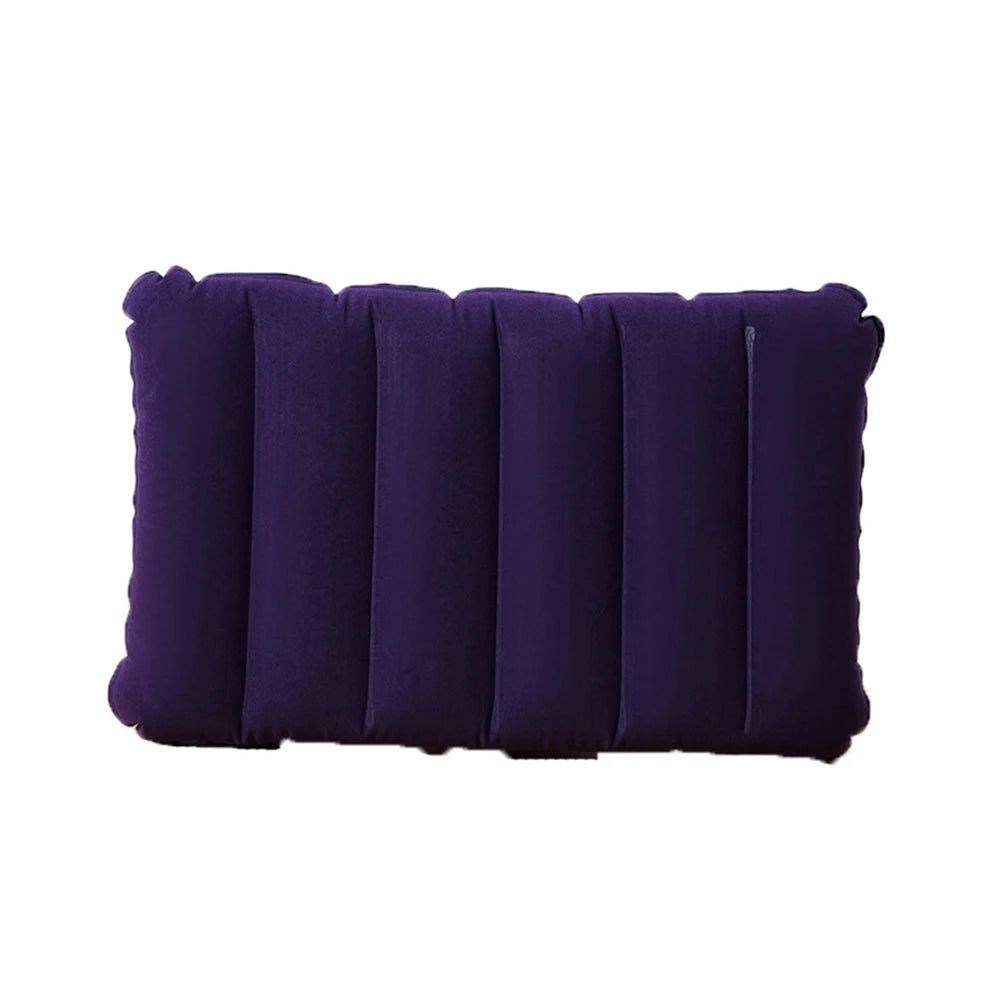 A dark purple inflatable travel pillow with ribbed texture.