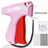 A pink and red needle box style random sewing tool with a flexible needle and multiple needles.