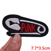 Black embroidered patch with the word PUNK and a heart design