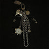 Silver star-shaped pocket watch keychain with a chain and a small bell.