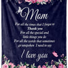 A dark blue velvet throw blanket featuring pink and purple floral embroidery with the text I love you