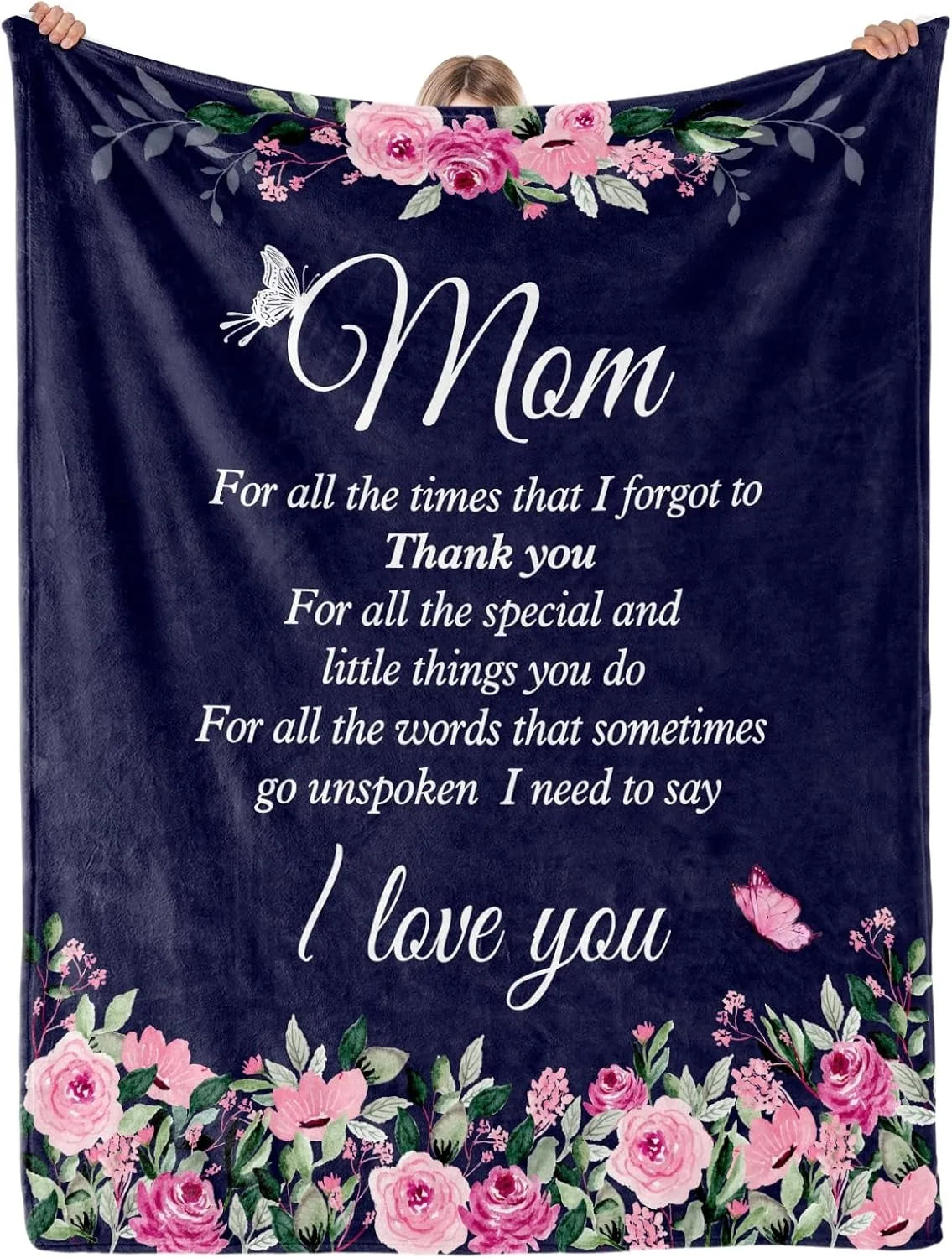 A dark blue velvet throw blanket featuring pink and purple floral embroidery with the text I love you