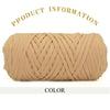 A tightly wound skein of thick beige polyester blended yarn for crafting.
