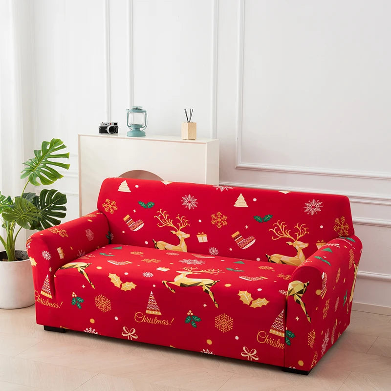 A red festive sofa cover featuring reindeer and Christmas patterns displayed indoors.