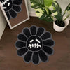 Black absorbent non-slip bathroom mat shaped like a gothic sunflower with a white skull design
