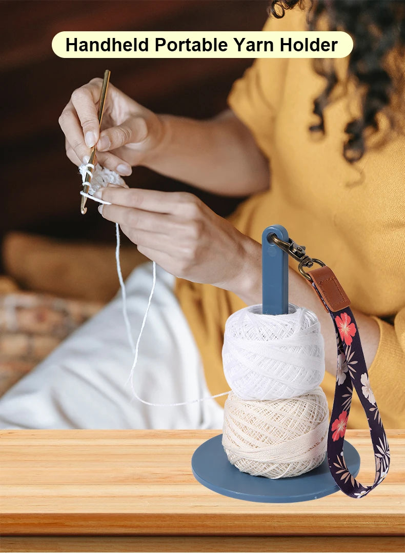 A person is using a handheld portable yarn holder to wind and manage yarn for knitting.