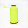 A spool of bright lime green heavy duty nylon sewing thread with a red cap.