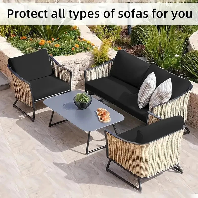 Wicker outdoor sofa set with black cushions and a glass table on a patio.
