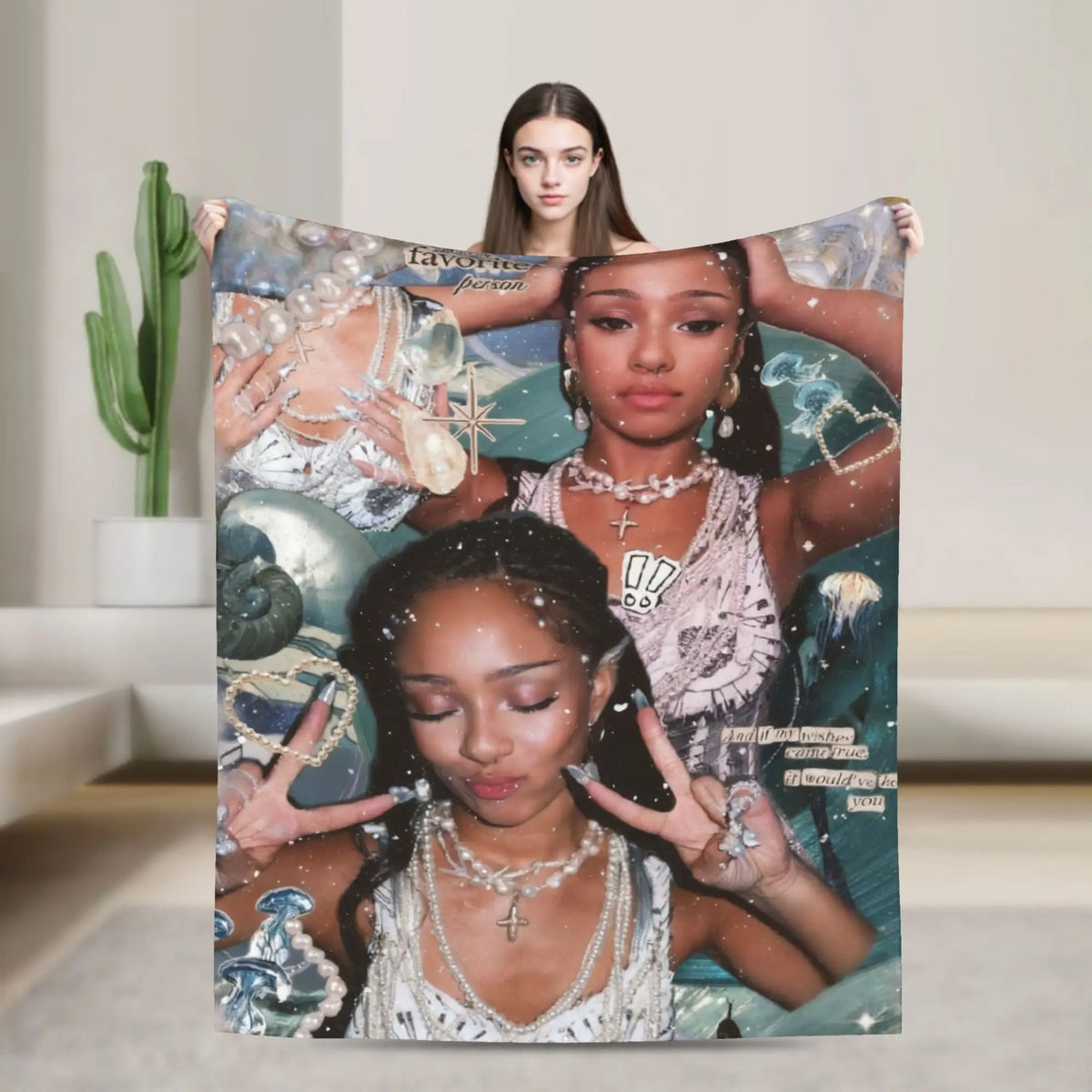 A woman is holding a large print featuring a K-Pop idol and text, against a blurred indoor background.