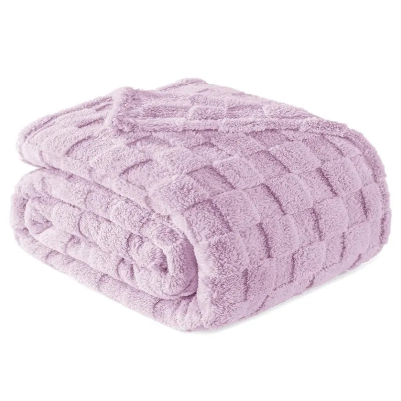A soft lavender checkered fleece throw blanket rolled up.