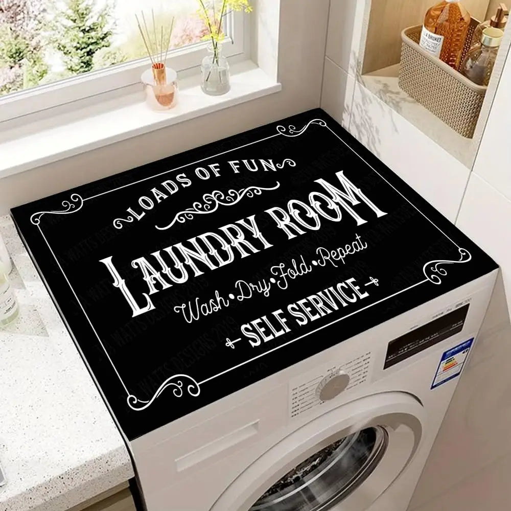 A black laundry room sign with white text reading Loads of Fun Laundry Room Wash Dry Fold Repeat and Self Service