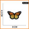 A set of five embroidered iron-on patches featuring orange and black butterfly designs.